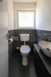 Architektonisch markantes Mehrfamilienhaus der klassischen Moderne - OG-Gäste WC