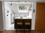 Architektonisch markantes Mehrfamilienhaus der klassischen Moderne - DG-Kochbereich