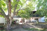 Architektonisch markantes Mehrfamilienhaus der klassischen Moderne - Gartenansicht